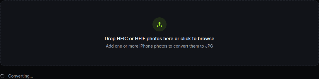 the tool showing a "Converting…" spinner right after a photo is dropped in